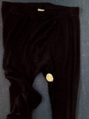 Black long johns featuring a striking pale spot